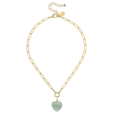 Gold chain necklace featuring a pale green heart pendant.
