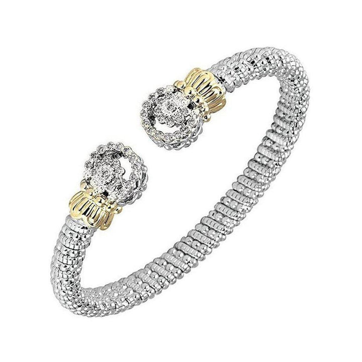 Diamond tip bracelet with gold accents, bezel-set diamonds.
