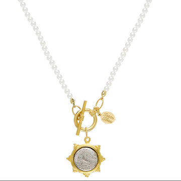 Dove Coin Pearl Toggle Necklace: Gold coin pendant, white pearl chain, toggle clasp.

