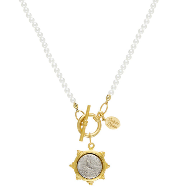Dove Coin Pearl Toggle Necklace: Gold coin pendant, white pearl chain, toggle clasp.
