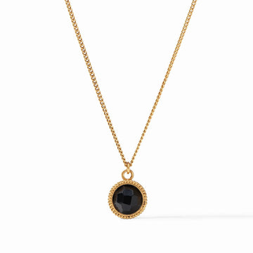 Gold chain necklace with a black gemstone pendant.
