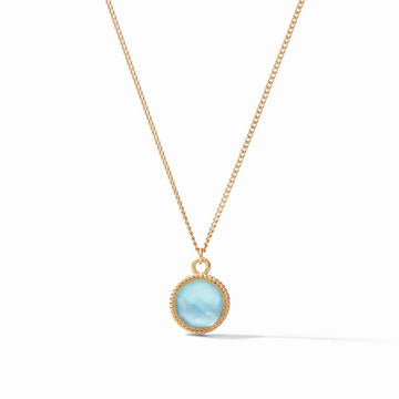 Gold chain necklace with light blue gemstone pendant.
