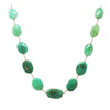 Green chrysoprase gemstone necklace with oval beads on a delicate cord.
