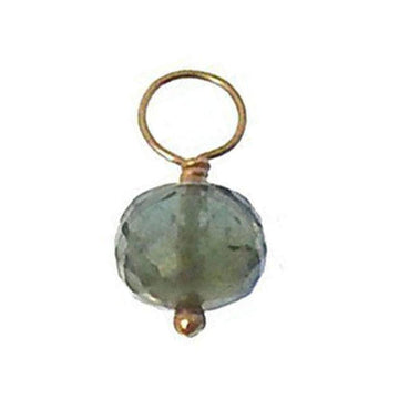Green gemstone charm with gold wire loop and bead.
