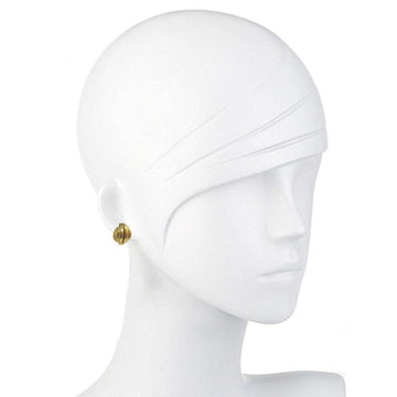 Gold button-style clip earrings on a mannequin.
