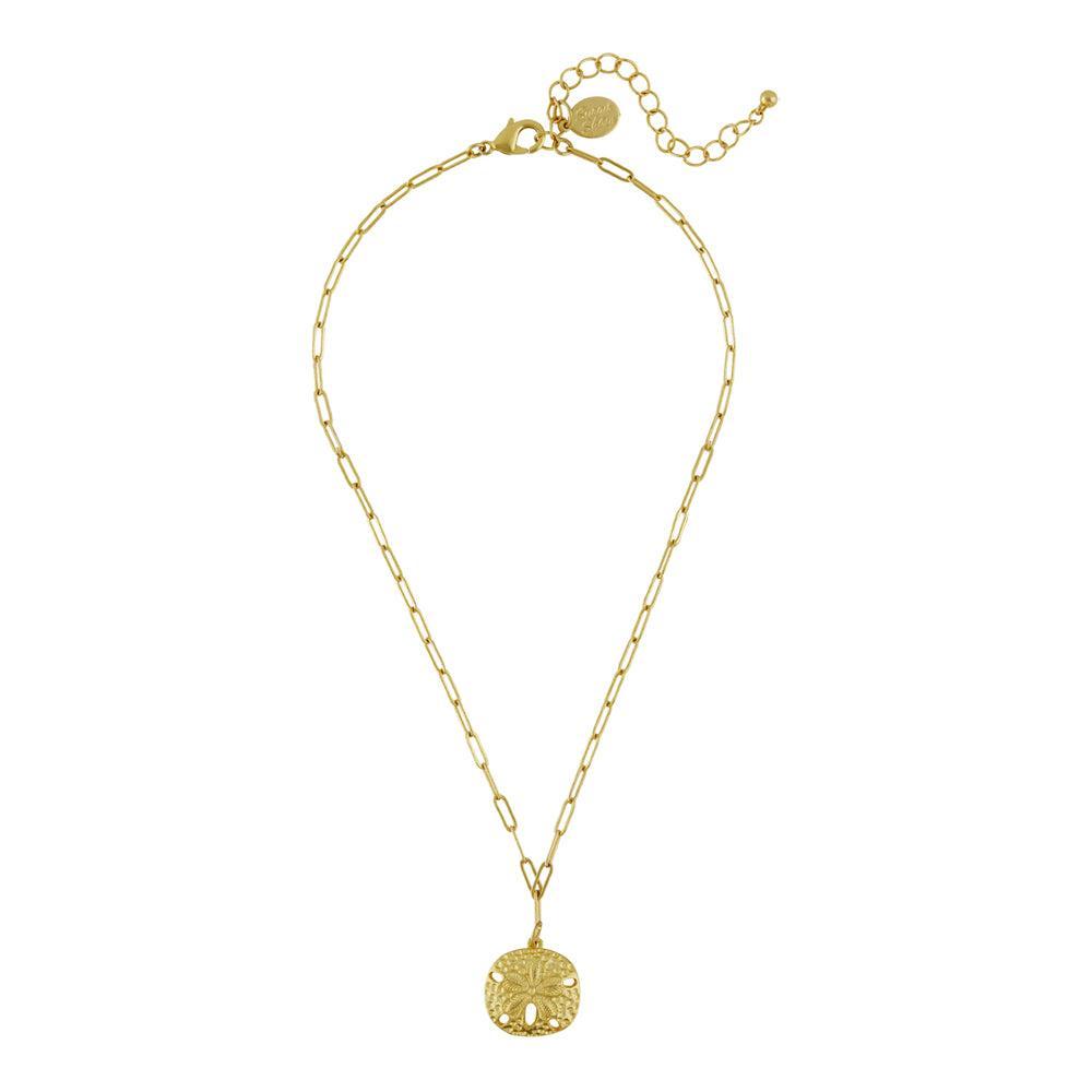 Gold sand dollar pendant necklace with delicate chain.
