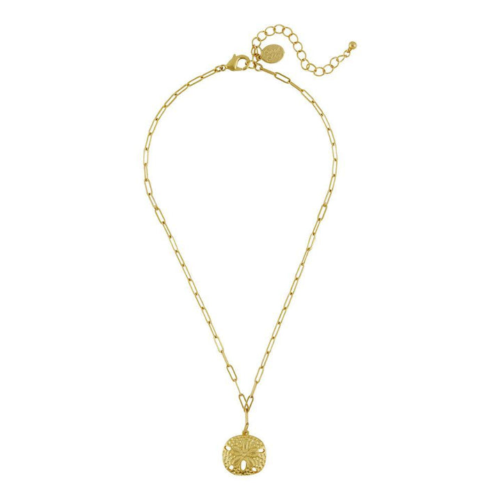 Gold sand dollar pendant necklace with delicate chain.
