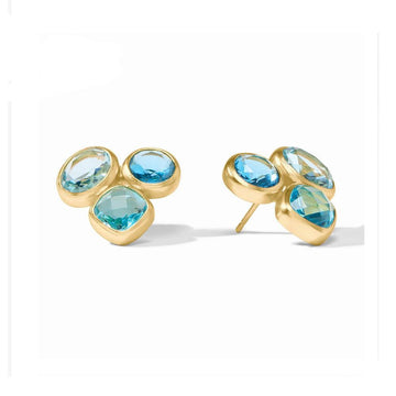 Gold stud earrings featuring blue gemstones in varying shapes and sizes.
