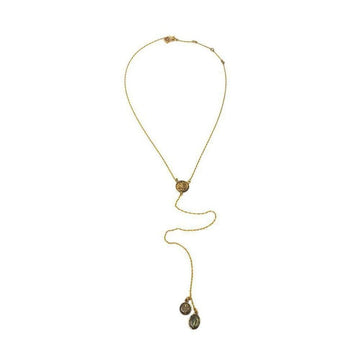 Gold lariat necklace with circular medallions; features a longer chain and smaller accents.
