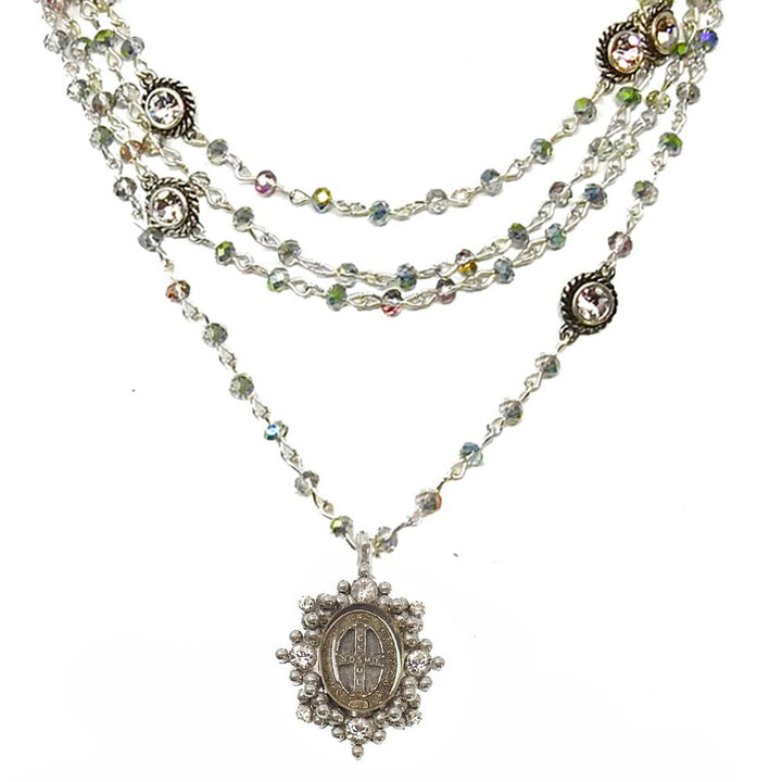 Silver multi-strand necklace with iridescent crystal beads and ornate pendant.
