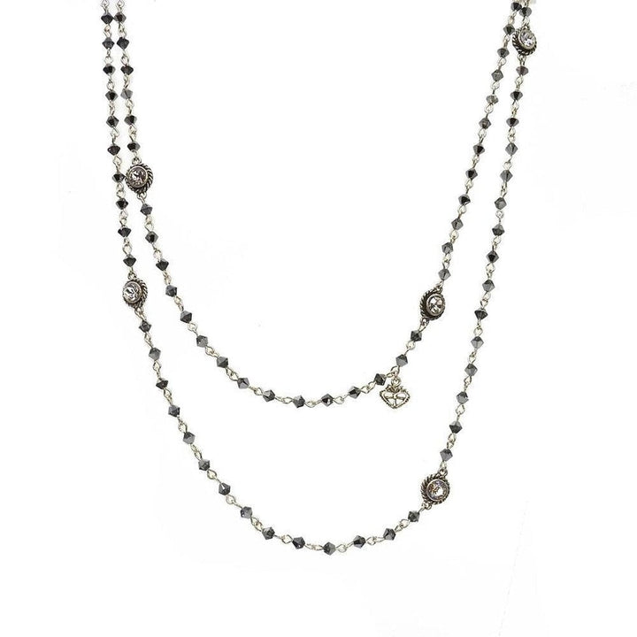 Double-strand necklace with dark gray crystals and silver accents.
