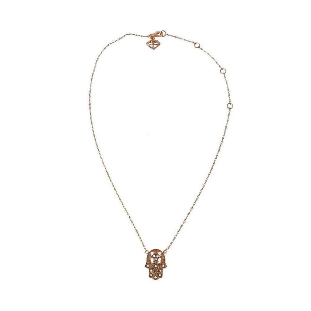 Rose gold hamsa necklace with delicate chain.
