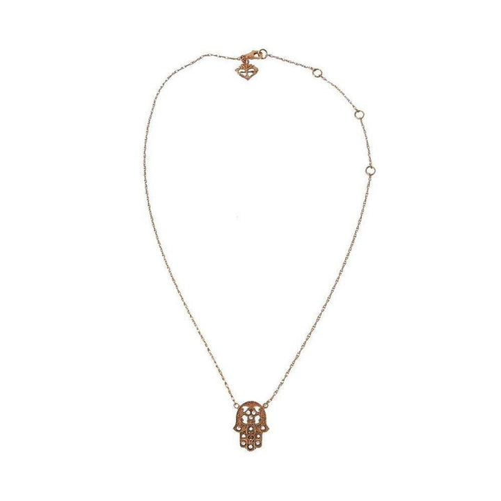 Rose gold hamsa necklace with delicate chain.
