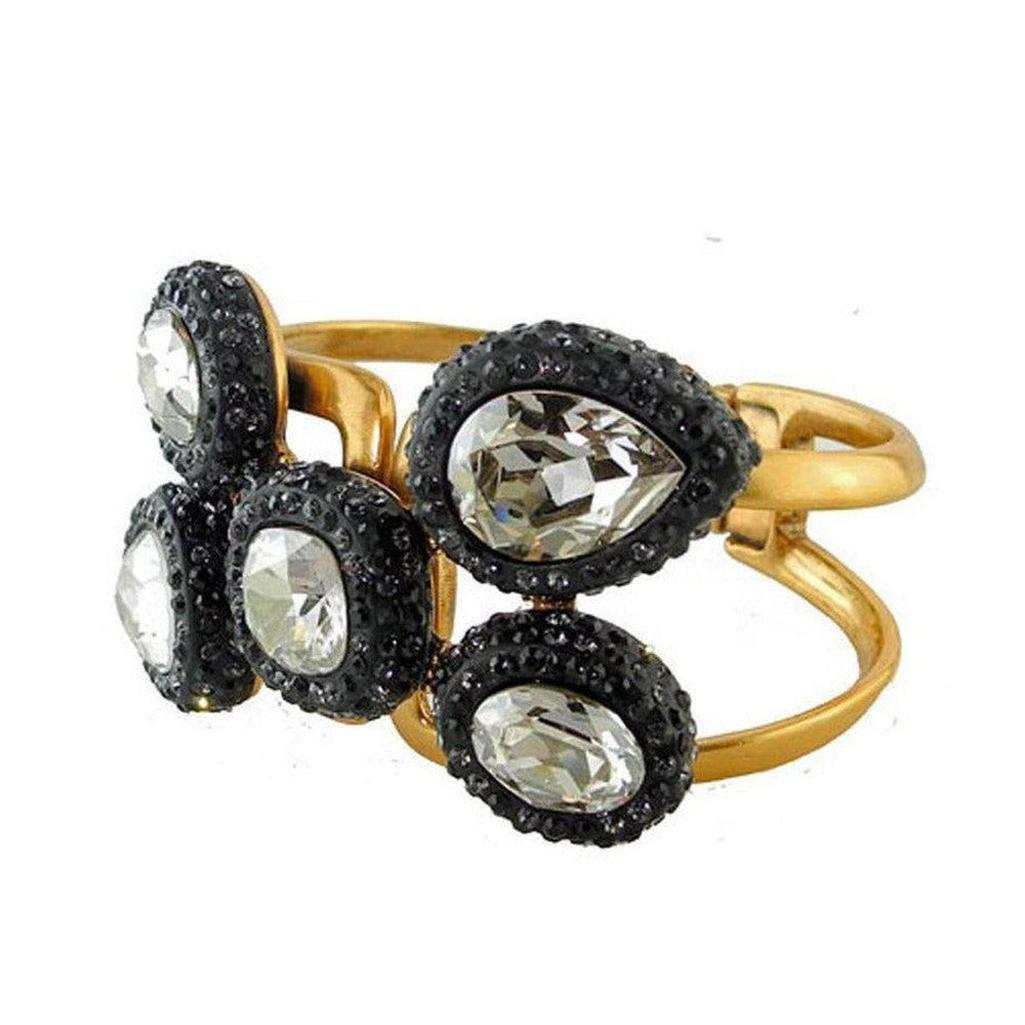 Oscar de la Renta Black Crystal Cuff: Goldtone hinged cuff bracelet featuring clear and black crystals.
