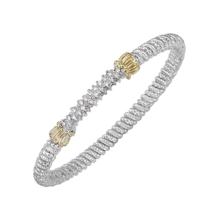 Pave Bar Bangle Bracelet with sparkling diamonds, gold accents, and a twisted silver band.

