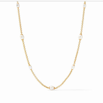 Marbella Pearl Station Necklace: Elegant gold chain with five lustrous pearls.
